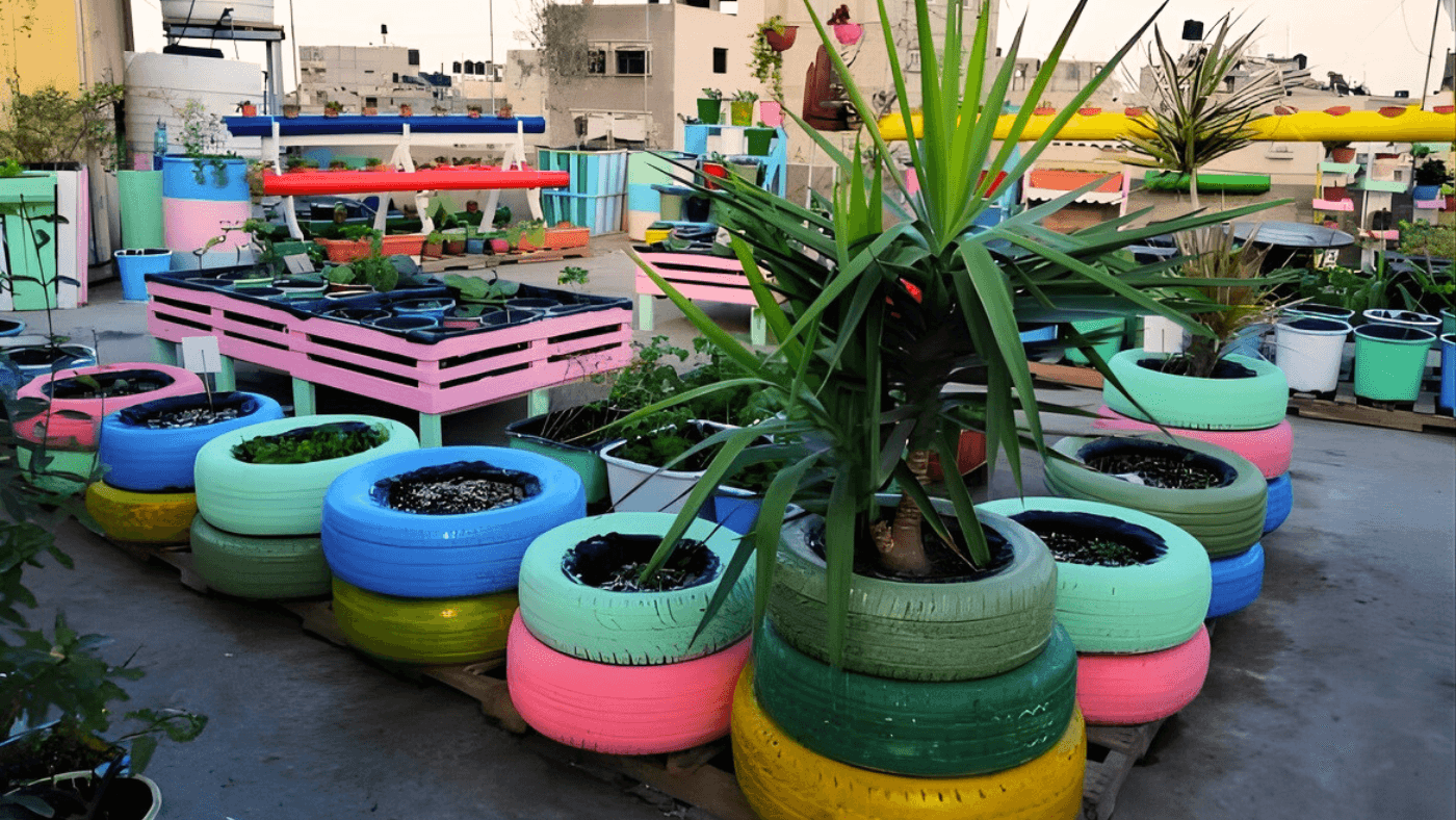 Rooftop garden with recycled tire planters on a residential building in Gaza – Veranda Design project